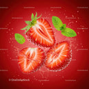 Fresh sliced strawberries with mint leaves and water splash