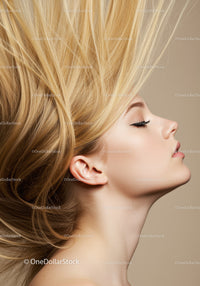 Profile of young woman with flowing blonde hair