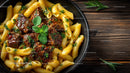 Beef Stroganoff with Mushrooms and Fettuccine on Wooden Table