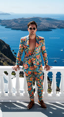 Man in vibrant floral suit overlooking scenic sea view
