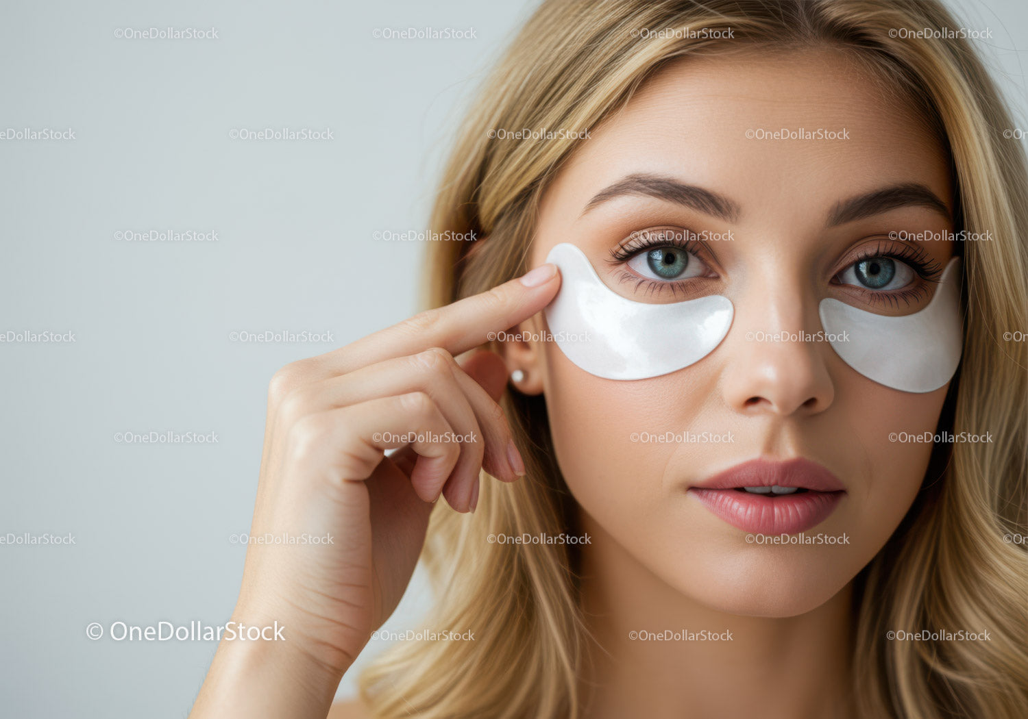 Woman Applying Eye Patches for Skincare and Beauty Routine
