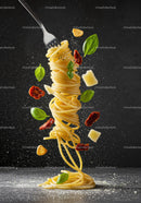 Fork twirling spaghetti with basil and parmesan shavings