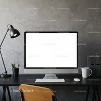 Modern minimalist workspace with blank computer screen