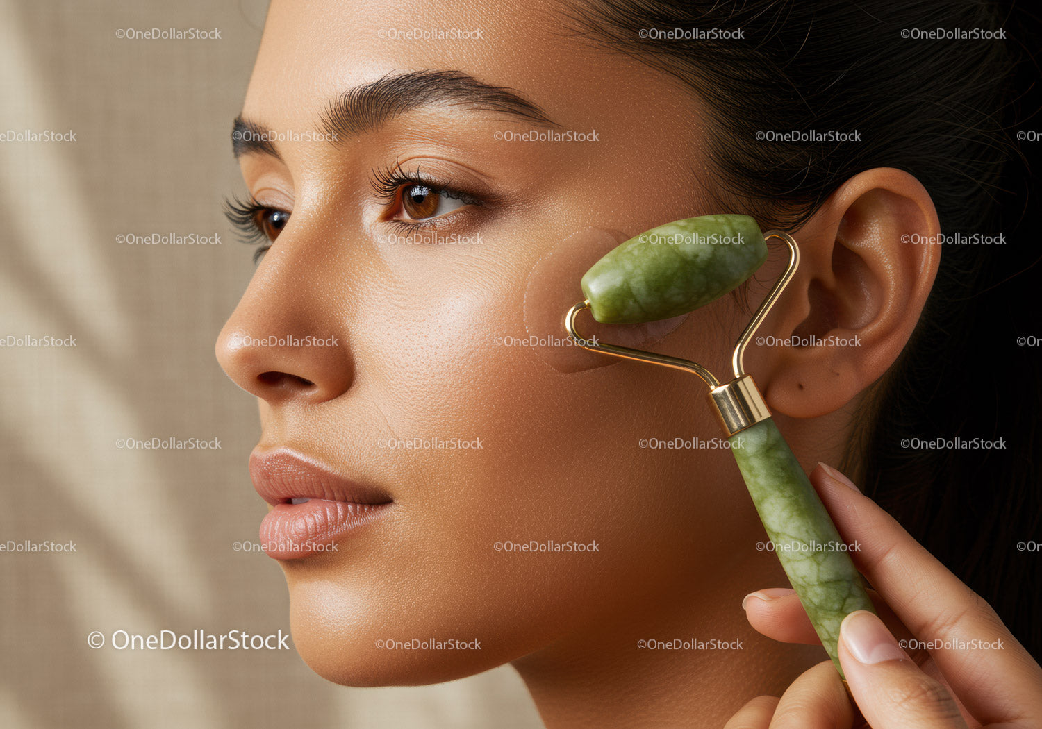 Woman Using Jade Roller for Facial Massage and Skin Rejuvenation