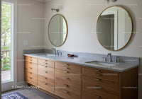 Modern Bathroom with Double Vanity and Oval Mirrors in Bright Natural Light