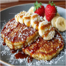 Golden Pancakes with Strawberries and Bananas in Sweet Caramel Drizzle