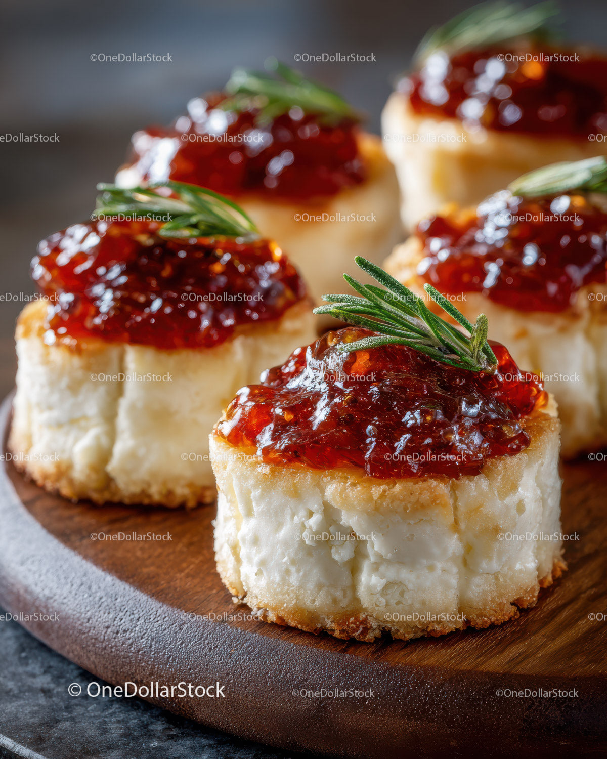 Cheese Bites with Herb Garnish on Rustic Wooden Board