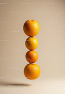 Stacked fresh oranges on neutral background