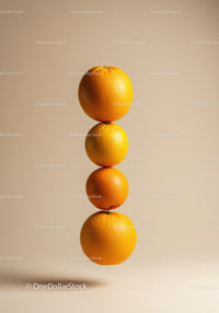 Stacked fresh oranges on neutral background
