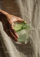 Refreshing cucumber infused sparkling water in hand