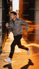 Man running through urban alley with motion blur