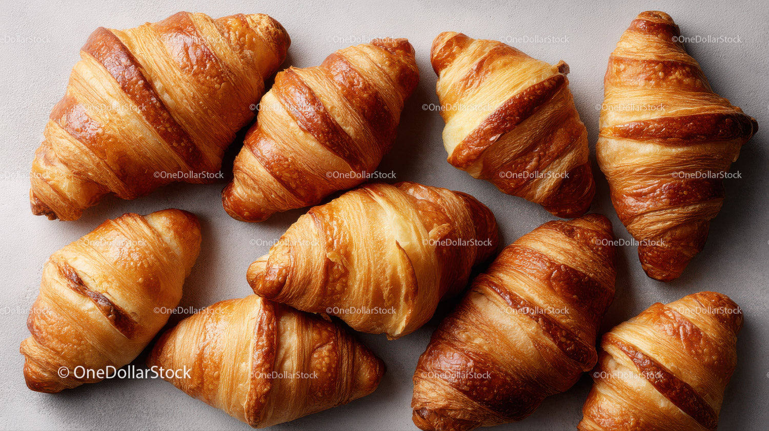 Fresh flaky croissants with golden layers for breakfast or snack