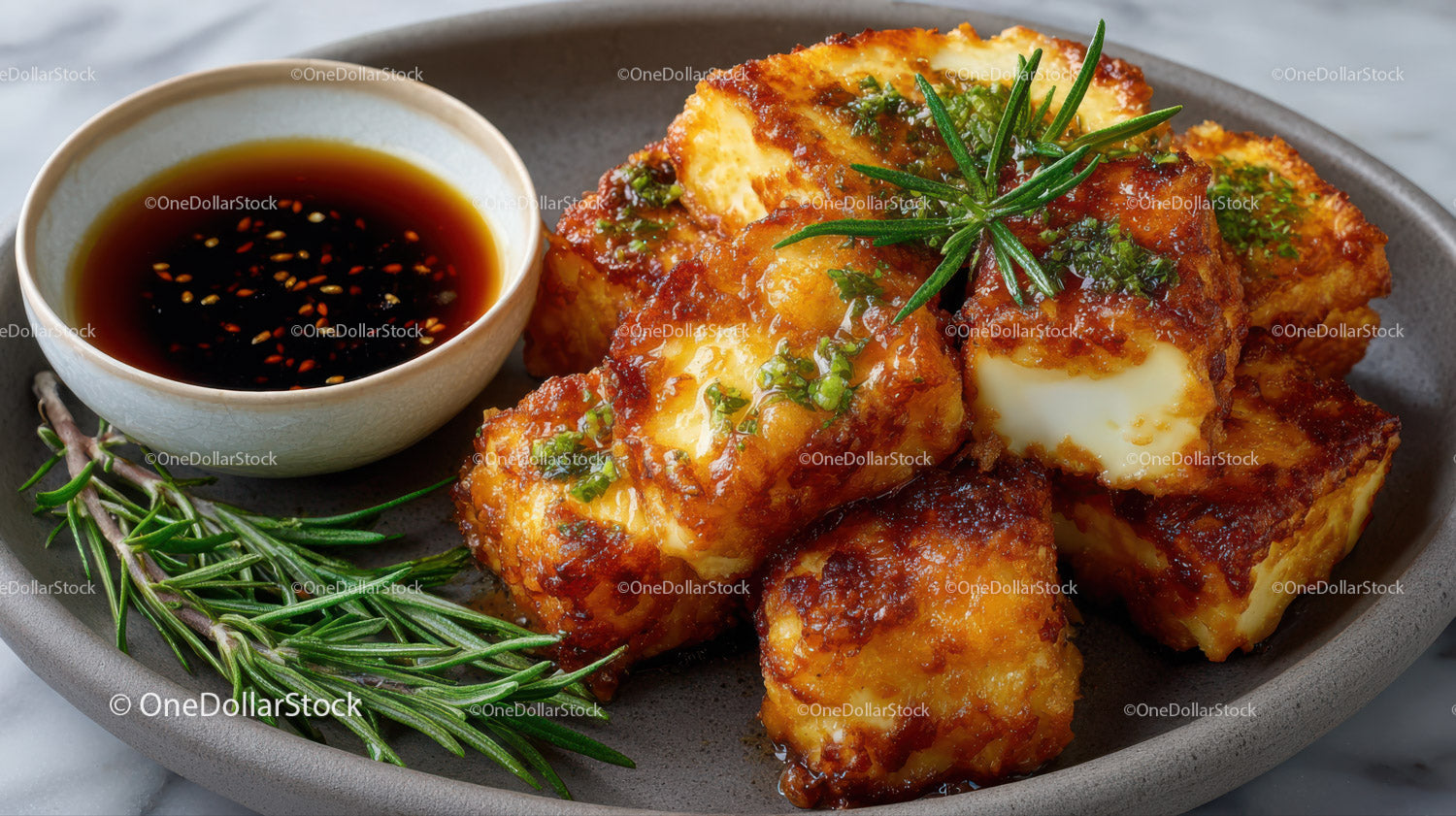 Crispy Fried Cheese Balls with Soy Sauce and Fresh Herbs