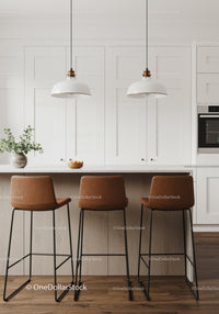 Contemporary Kitchen with White Cabinets Wooden Bar Stools and Pendant Lighting