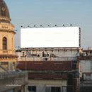 Empty city rooftop billboard against clear sky
