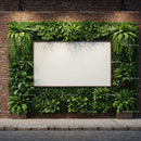 Urban green wall with blank white billboard on brick facade