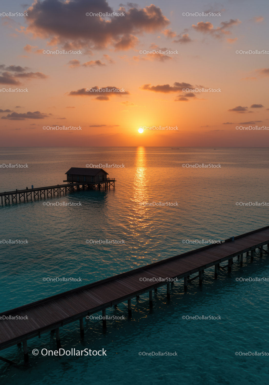 Scenic Sunset Over Ocean Pier with Calm Water and Dramatic Sky