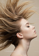 Young woman with flowing blonde hair profile pose