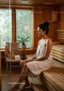 Relaxing Woman Sitting in Wooden Sauna Spa Wellness Room