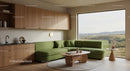 Modern living room with green sofa and scenic window view