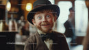 Young Man in Vintage Costume with Top Hat Smiling Cheerfully