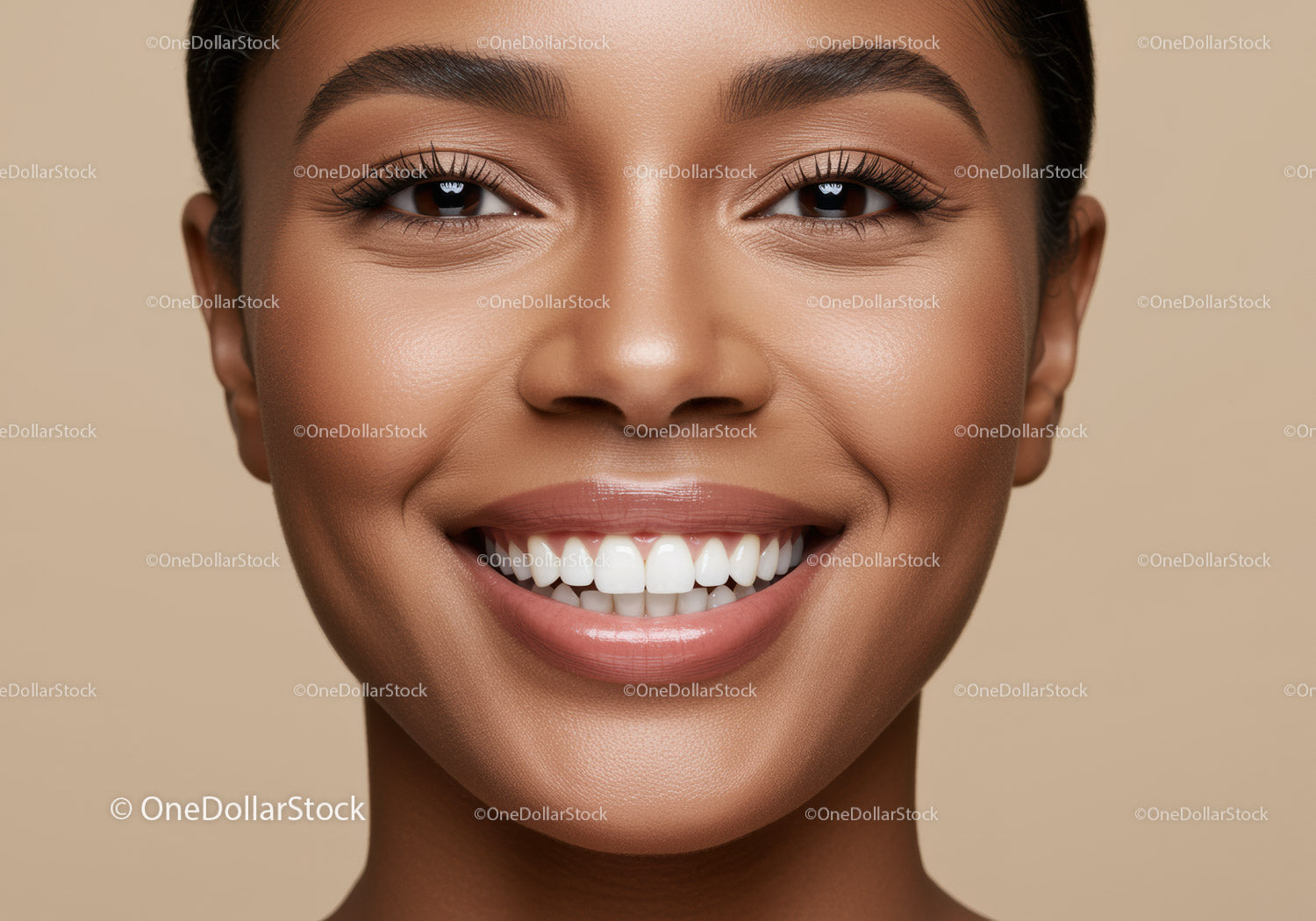 Close up of smiling woman with radiant skin and perfect teeth