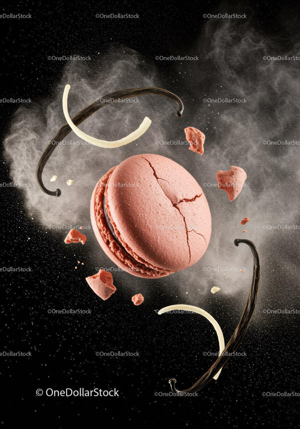 Cracked pink macaron with vanilla beans and powder