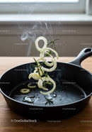 Sizzling Onions and Fresh Rosemary in Cast Iron Skillet