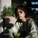 Stylish Woman Wearing Sunglasses Holding Green Cocktail Outdoors