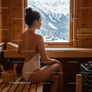Relaxing Woman Sitting in Sauna with Snowy Mountain View