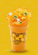 Fresh tropical smoothie splashing with fruit cubes