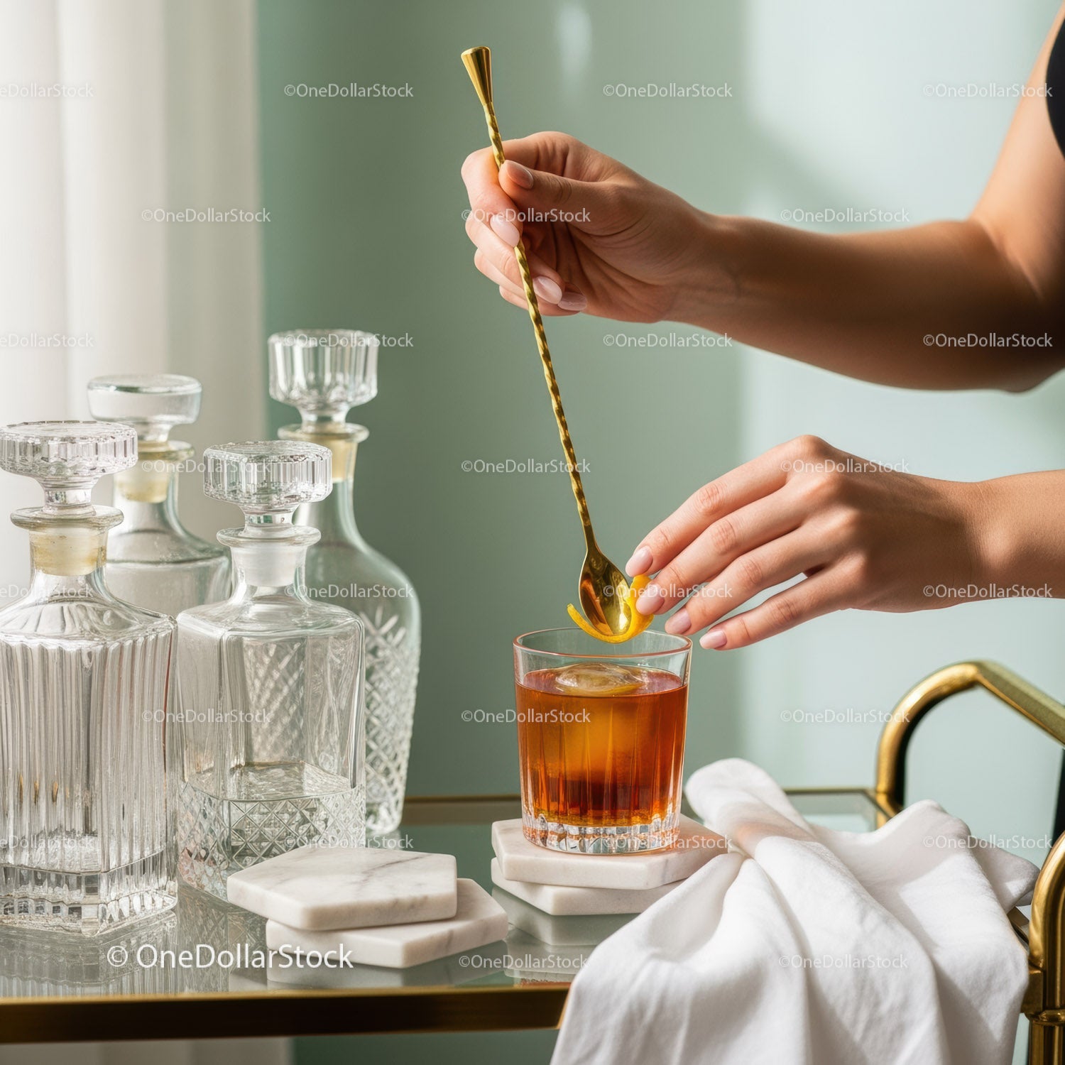 Elegant Amber Cocktail Being Stirred with Gold Bar Spoon