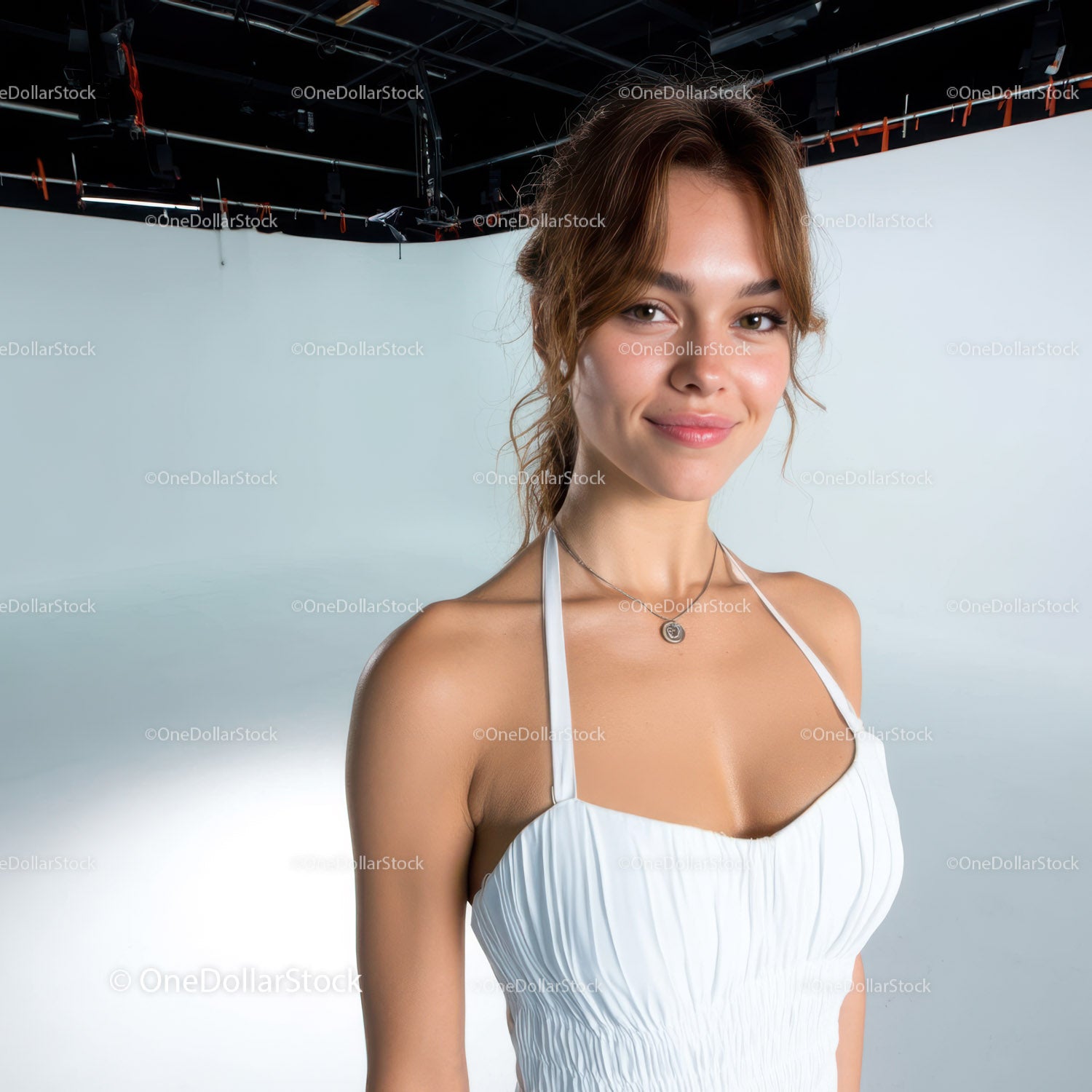 Portrait of a smiling woman in a white dress at a photo studio