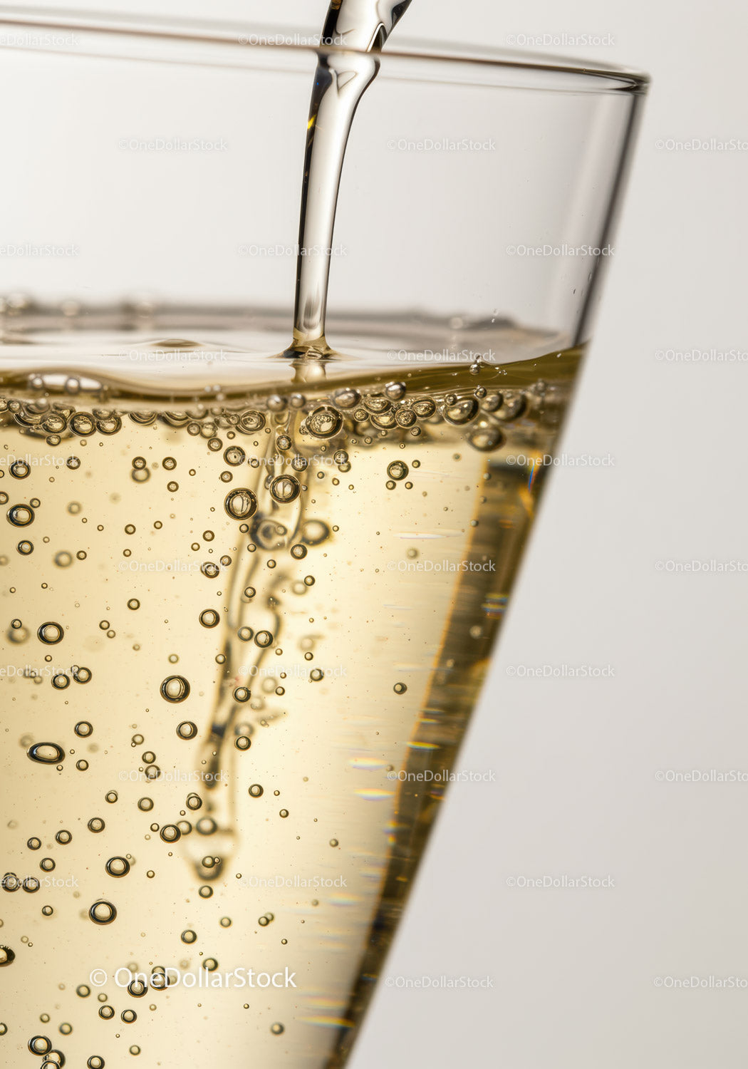 Close-up of sparkling drink filling a glass