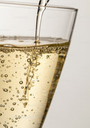Close-up of sparkling drink filling a glass