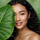 Portrait of a Beautiful Woman with a Tropical Leaf and Black Curly Hair