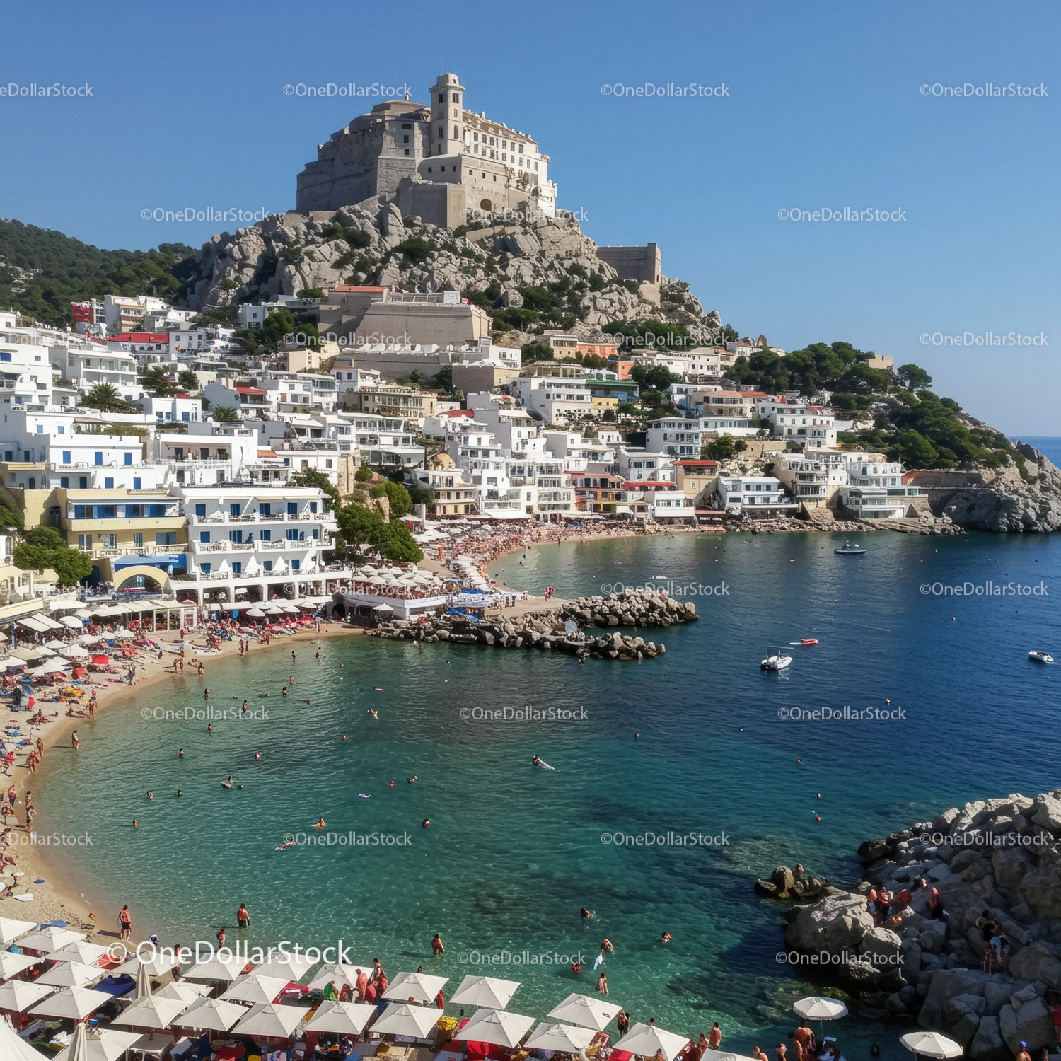 Picturesque Mediterranean Coastal Town with White Buildings and Clear Turquoise Water