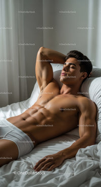 Relaxed young man resting peacefully on white bed