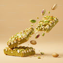 Green Pistachio Nut Bar Breaking in Midair