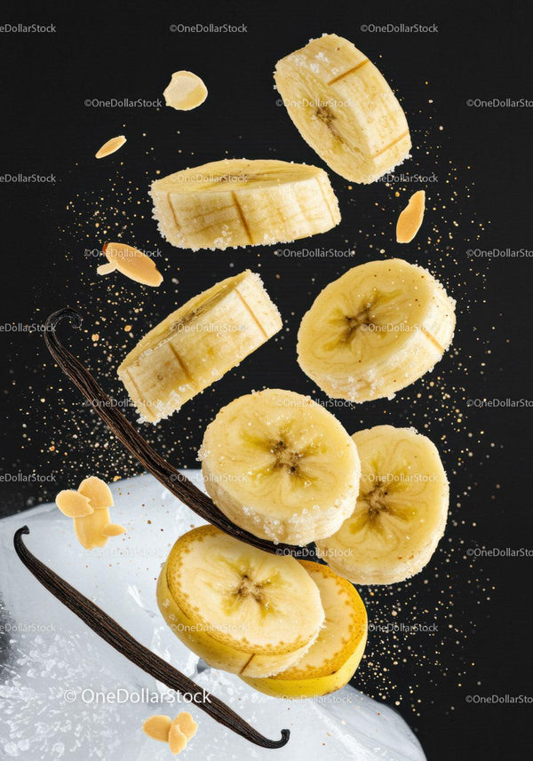 Banana slices and vanilla pods with sugar and nuts