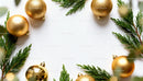 Golden Christmas baubles with green pine branches frame