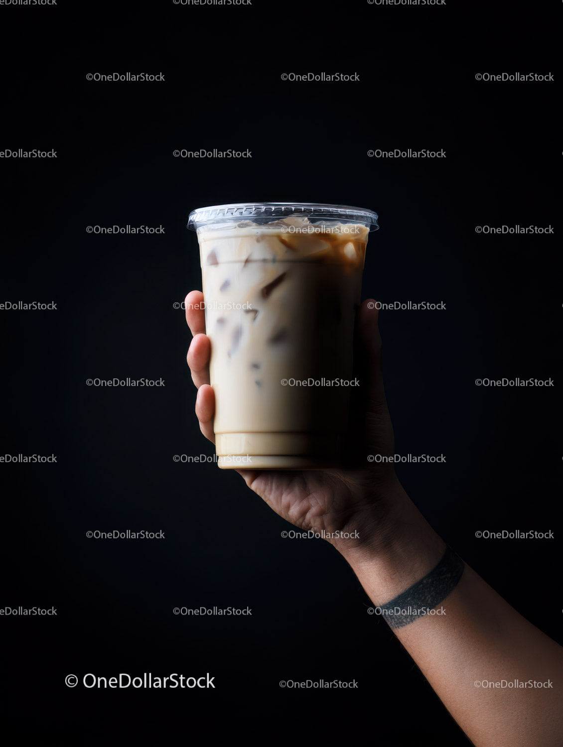 Iced Coffee in Glass Cup with Milk Swirl on Dark Background