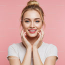 Bright Smile of Young Woman with Blonde Hair Against Pink Background