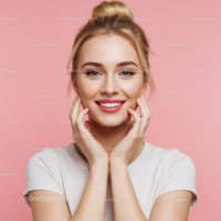 Bright Smile of Young Woman with Blonde Hair Against Pink Background