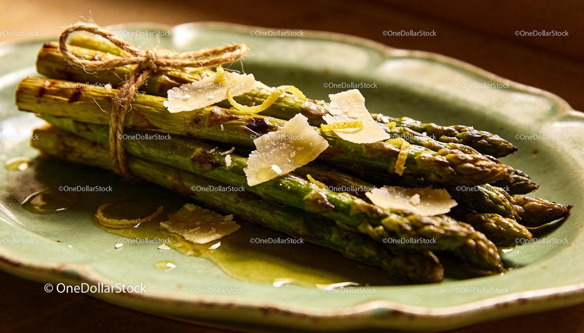Grilled asparagus garnished with parmesan cheese
