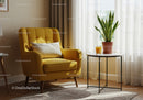 Cozy yellow armchair by sunny window with plant