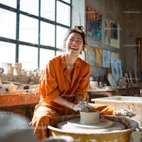 Joyful Woman Creating Handmade Pottery in Artistic Studio
