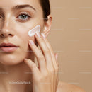 Close-Up of Woman Applying Skincare Cream to Cheek for Healthy Skin
