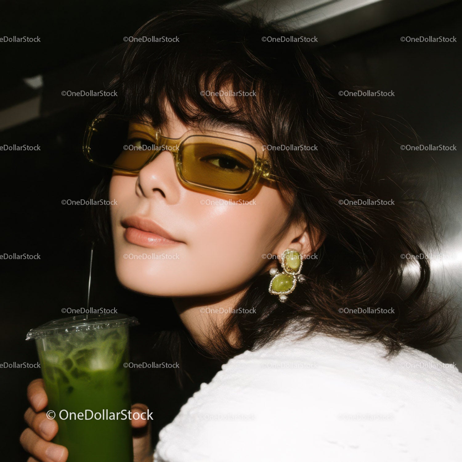 Stylish Woman Wearing Yellow Sunglasses with Green Cocktail