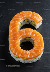 Salmon and avocado sushi roll shaped like number six